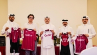 QCTF President Eng Abdulaziz Saud Al Tamimi (centre) and Bioracer CEO Danny Segers (second left) with other QCTF officials hold cycling gear delivered by Bioracer.