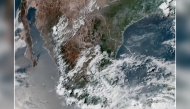 This handout satellite image obtained from the National Oceanic and Atmospheric Administration (NOAA)/GOES shows Tropical Storm Erick over southern Mexico on June 17, 2025. Photo by Handout / NOAA / AFP