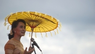 File: National League for Democracy chairperson Aung San Suu Kyi delivers a speech during a voter education campaign in Hsiseng township in Shan State on September 5, 2015. (Photo by Ye Aung Thu / AFP)