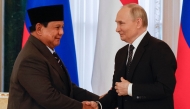 Russia's President Vladimir Putin (right) and his Indonesian counterpart Prabowo Subianto attend signing ceremony after their meeting in Saint Peterburg on June 19, 2025. (Photo by Anatoly Maltsev / POOL / AFP)
