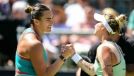 Belarus' Aryna Sabalenka (L) congratulates Czech Republic's Marketa Vondrousova after during their semi-final match at the WTA tennis tournament in Berlin on June 21, 2025. (Photo by Tobias Schwarz / AFP)