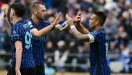 Inter Milan players celebrate their victory at the end of the FIFA Club World Cup 2025 Group E football match between Italy's Inter Milan and Japan's Urawa Red Diamonds at the Lumen Field stadium in Seattle on June 21, 2025. (Photo by Pablo Porciuncula / AFP)
