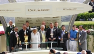 Britain's King Charles III and Queen Camilla pose with the connections of Lazzat, winner of the Queen Elizabeth II Jubilee Stakes on the final day of the Royal Ascot racing meeting.