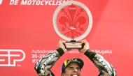 Winner Ducati Lenovoi Team's Spanish MotoGP rider Marc Marquez celebrates on the podium with the trophy after the Italian Moto GP Grand Prix at Mugello circuit, in Mugello, near Florence, on June 22, 2025. (Photo by Tiziana FABI / AFP)