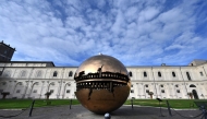 A view shows the 'Sphere within a sphere' by italian artist Arnaldo Pomodoro in the Vatican Museum on its reopening day to the public on February 1, 2021 in Vatican City. Photo by Andreas SOLARO / AFP