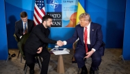 In this handout photograph taken and released by the Ukrainian Presidential Press Service on June 25, 2025, Ukraine's President Volodymyr Zelensky (left) shakes hands with US President Donald Trump during their meeting on the sideline of the North Atlantic Treaty Organization (NATO) summit in The Hague. (Photo by Handout / AFP)