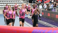 Kenya’s Faith Kipyegon (right) takes part in the 'Breaking4' event, in an attempt to become the first woman to run a mile in under four minutes, in Paris.