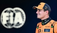 Pole position winner McLaren's British driver Lando Norris looks on next to the FIA logo after the qualifying session at the Red Bull Ring race track in Spielberg, Austria, on June 28, 2025, ahead of the Formula One Austrian Grand Prix. (Photo by Joe Klamar / AFP)
