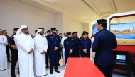 Officials at the exhibition being held at Place Vendome Mall in Lusail