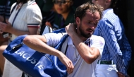 Russia's Daniil Medvedev leaves the court following his defeat against France's Benjamin Bonzi during their men's singles first round tennis match on the first day of the 2025 Wimbledon Championships at The All England Lawn Tennis and Croquet Club in Wimbledon, southwest London, on June 30, 2025. (Photo by Kirill KUDRYAVTSEV / AFP) 

