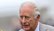 Britain's King Charles III talks with a Member of Royal Company of Archers during the traditional Ceremony of the Keys in the Gardens of the Palace of Holyroodhouse in Edinburgh, Scotland on July 1, 2025, on the first day of their Majesties The King and Queen's visit to Scotland. (Photo by ANDY BUCHANAN / AFP)