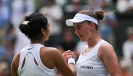 Czech Republic's Barbora Krejcikova (R) shakes hands with Philippines' Alexandra Eala after winning their women's singles first round tennis match on the second day of the 2025 Wimbledon Championships at The All England Lawn Tennis and Croquet Club in Wimbledon, southwest London, on July 1, 2025. (Photo by Glyn KIRK / AFP) 