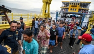 The survivors of the sunken ferry accident arrive at Ketapang port aboard another ferry in Banyuwangi, East Java, on July 3, 2025, after being rescued and evacuated to Gilimanuk Port in Bali. Photo by AFP.