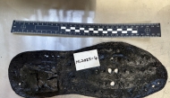 A June 19, 2025 handout photo released by The Vindolanda Trust in London on July 3, 2025, shows a section of a large leather shoe, one of 32 shoes uncovered so far, by the Trust during an excavation at Magna Roman Fort, near Greenhead, northeast England. Photo by The Vindolanda Trust / AFP.