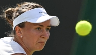 Czech Republic's Barbora Krejcikova eyes the ball as she plays against US player Caroline Dolehide during their women's singles second round tennis match on the fourth day of the 2025 Wimbledon Championships at The All England Lawn Tennis and Croquet Club in Wimbledon, southwest London, on July 3, 2025. (Photo by Glyn KIRK / AFP) / RESTRICTED TO EDITORIAL USE
