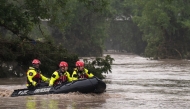 Boerne Search and Rescue teams navigate upstream in an inflatable boat on the flooded Guadalupe River on July 4, 2025 in Comfort, Texas. Heavy rainfall caused flooding along the Guadalupe River in central Texas with multiple fatalities reported. (Photo by Eric Vryn / GETTY IMAGES NORTH AMERICA / Getty Images via AFP)