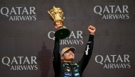 McLaren’s Lando Norris lifts the trophy after winning the Formula One British Grand Prix.