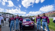 Qatar Motor and Motorcycle Federation President Abdulrahman bin Abdullatif Al Mannai (third left) poses with the QMMF by Saintéloc Racing drivers at the Spa-Francorchamps circuit.