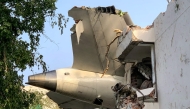 The back of Air India flight 171 is pictured at the site after it crashed in a residential area near the airport in Ahmedabad on June 12, 2025. (Photo by Sam Panthaky / AFP)