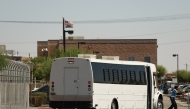 A shuttle bus transports detainees outside the private prison company GEO Group Adelanto ICE Processing Center detention facility in Adelanto, California, on July 11, 2025. (Photo by Patrick T. Fallon / AFP)