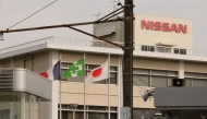 The national flags of France (L) and Japan (R) are displayed at an entrance of Japan's Nissan Motor's Oppama plant in Yokosuka, Kanagawa prefecture, on November 26, 2018. Photo by Kazuhiro NOGI / AFP