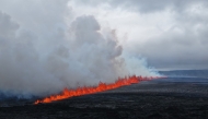 Handout picture released on July 16, 2025 by the Public Defense Department of the State Police Commissioner in Iceland shows lava and smoke erupting from a volcano near Grindavik on the Icelandic peninsula of Reykjanes. Photo by Handout / Public Defense Department of the State Police / AFP