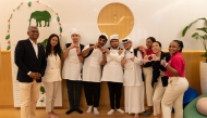 Children and caregivers from The Shafallah Center and Best Buddies with Raffles and Fairmont Doha staff.
