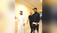 Al Gharafa's new signing Mason Holgate (right) arrives at the Club's headquarters.
