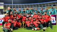 Bangladesh's players pose with the trophy after winning the Third and final Twenty20 international cricket match between Sri Lanka and Bangladesh at the R. Premadasa International Cricket Stadium in Colombo. Photo by Ishara S. KODIKARA / AFP