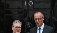 Britain's Prime Minister Keir Starmer poses with Germany's Chancellor Friedrich Merz, outside 10 Downing Street in London on July 17, 2025, ahead of their talks. (Photo by JUSTIN TALLIS / AFP)