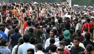Fans gather to greet the players of Royal Challengers Bengaluru (RCB) after their victory in Indian Premier League (IPL) Twenty20 final cricket match, outside M.Chinnaswamy Stadium in Bengaluru on June 4, 2025. (Photo by Idrees MOHAMMED / AFP)

