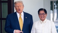 US President Donald Trump welcomes Filipino President Ferdinand Marcos Jr. at the entrance to the West Wing of the White House in Washington, DC on July 22, 2025. (Photo by SAUL LOEB / AFP)
