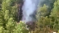 This video grab from a handout footage released by the Eastern Interregional Directorate for Transport of the Russian Investigative Committee on July 24, 2025, shows an aerial view of the crash site of the Antonov AN-24 passenger plane outside the town of Tynda in Russia's far eastern Amur region. Photo by Handout / Investigative Committee of Russia / AFP