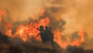 File photo: Firemen battle with a wildfire that broke out in Ierapetra at the southern Greek island of Crete, on July 3, 2025. Photo by Costas Metaxakis / AFP