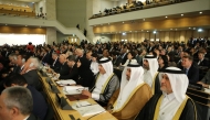 Shura Council Speaker H E Hassan bin Abdullah Al Ghanim with other delegates during the conference.