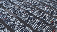 Aerial view shows new cars of various brands that are parked ready for sale at a car logistics terminal in Essen, western Germany, on November 22, 2024. Photo by Ina FASSBENDER / AFP
