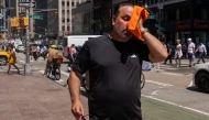 People try to stay cool on the sweltering streets of Manhattan as the region experiences another heatwave on July 29, 2025 in New York City. Photo by SPENCER PLATT / GETTY IMAGES NORTH AMERICA / Getty Images via AFP.
