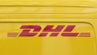 This photograph shows the logo of DHL, a US founded multinational courier company, in Paris on July 30, 2025. (Photo by Martin LELIEVRE / AFP)
