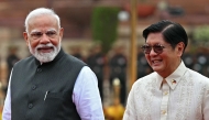 Philippine President Ferdinand Marcos (R) listens to India's Prime Minister Narendra Modi during the ceremonial reception at India's presidential palace Rashtrapati Bhavan in New Delhi on August 5, 2025.Photo by Sajjad HUSSAIN / AFP