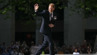 (Files) Britain's Prince Harry, Duke of Sussex waves as he arrives to attend a ceremony marking the 10th anniversary of the Invictus Games, in central London, on May 8, 2024. (Photo by Justin Tallis / AFP)

