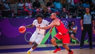 Qatar's Brandon Goodwin (left) in action during the match.