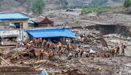Rescue workers search for survivors after a flash flood in Yuzhong county, in China's northwest Gansu province on August 8, 2025. (Photo by AFP)