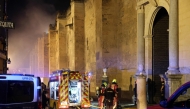 Firefighters work to extinguish a fire which broke out in the historic mosque-turned-cathedral in the southern Spanish city of Cordoba on August 8, 2025. (Photo by Madero Cubero / AFP)