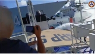 This handout video grab released and taken on August 11, 2025 by the Philippine Coast Guard shows an incident between a Chinese Navy vessel (L) and a Chinese Coast Guard ship (R) as seen from a Philippine fisheries boat near Scarborough Shoal in the disputed South China Sea. Photo by Handout / Philippine Coast Guard (PCG) / AFP