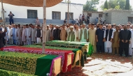 Local residents offer funeral prayers for mudslide victims in Danyor village in Pakistan's Gilgit-Baltistan region on August 11, 2025. Photo by AFP