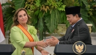 Indonesia's President Prabowo Subianto (R) and Peru's President Dina Boluarte hold a joint press conference following their meeting at the Merdeka Palace in Jakarta on August 11, 2025. (Photo by Bay ISMOYO / AFP)