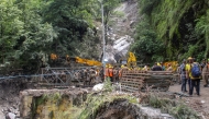 Army and rescue personnel construct a bailey bridge near the Bhatwari village in the Uttarkashi district on August 8, 2025. (Photo by AFP)
