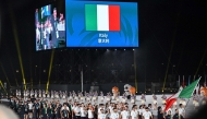 Members of Italy's delegation wave their country's national flag as they take part in the athletes' parade during the opening ceremony of the 2025 World Games at the Tianfu International Convention Centre in Chengdu, in China's southwestern Sichuan province on August 7, 2025. Photo by JADE GAO / AFP