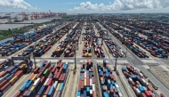 Containers are seen at the port in Shanghai on August 12, 2025. (Photo by AFP) 