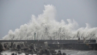This picture taken and released by Taiwan's Central News Agency (CNA) on August 13, 2025 shows waves generated by Typhoon Podul breaking along the coast in Taitung.  Photo by CNA / AFP